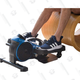 A person's legs and feet rest on the FlexStride pedal exerciser.